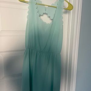 Mint colored sleeveless dress.